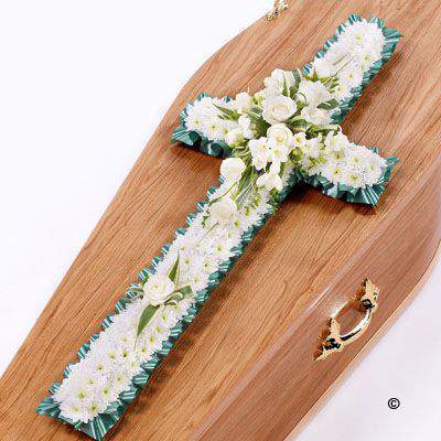 <h2>Classic Cross-Shaped Design with White Roses | Funeral Flowers</h2>
<ul>
<li>Approximate Size W 45cm H 92cm</li>
<li>Hand created classic white cross in fresh flowers</li>
<li>To give you the best we may occasionally need to make substitutes</li>
<li>Funeral Flowers will be delivered at least 2 hours before the funeral</li>
<li>For delivery area coverage see below</li>
</ul>
<br>
<h2>Liverpool Flower Delivery</h2>
<p>We have a wide selection of Funeral Crosses offered for Liverpool Flower Delivery. Funeral Crosses can be provided for you in Liverpool, Merseyside and we can organize Funeral flower deliveries for you nationwide. Funeral Flowers can be delivered to the Funeral directors or a house address. They can not be delivered to the crematorium or the church.</p>
<br>
<h2>Flower Delivery Coverage</h2>
<p>Our shop delivers funeral flowers to the following Liverpool postcodes L1 L2 L3 L4 L5 L6 L7 L8 L11 L12 L13 L14 L15 L16 L17 L18 L19 L24 L25 L26 L27 L36 L70 If your order is for an area outside of these we can organise delivery for you through our network of florists. We will ask them to make as close as possible to the image but because of the difference in stock and sundry items it may not be exact.</p>
<br>
<h2>Liverpool Funeral Flowers | Crosses</h2>
<p>This classic funeral cross has been loving handcrafted by our expert florists and features a mass of white spray chrysanthemums, together with a spray of white roses and freesia and luscious green foliage completes this traditional design.</p>
<br>
<p>Funeral crosses are symbols of belief they reaffirm faith and provide comfort at this difficult time.</p>
<p><br />In the larger sizes (from 4ft up) they are appropriate as the main tribute but smaller sizes are sometimes chosen by close friends as they represent extremely personal sentiments and feelings.</p>
<br>
<p>Containing 25 white double spray chrysanthemums, 5 white large-headed roses, 6 white freesia and seasonal mixed foliage.</p>
<br>
<h2>Best Florist in Liverpool</h2>
<p>Trust Award-winning Liverpool Florist, Booker Flowers and Gifts, to deliver funeral flowers fitting for the occasion delivered in Liverpool, Merseyside and beyond. Our funeral flowers are handcrafted by our team of professional fully qualified who not only lovingly hand make our designs but hand-deliver them, ensuring all our customers are delighted with their flowers. Booker Flowers and Gifts your local Liverpool Flower shop.</p>
<br>
<p><em>Janice Crane - 5 Star Review on Google - Funeral Florist Liverpool</em></p>
<br>
<p><em>I recently had to order a floral tribute for my sister in laws funeral and the Booker Flowers team created a beautifully stunning arrangement. Thank you all so much, Janice Crane.</em></p>